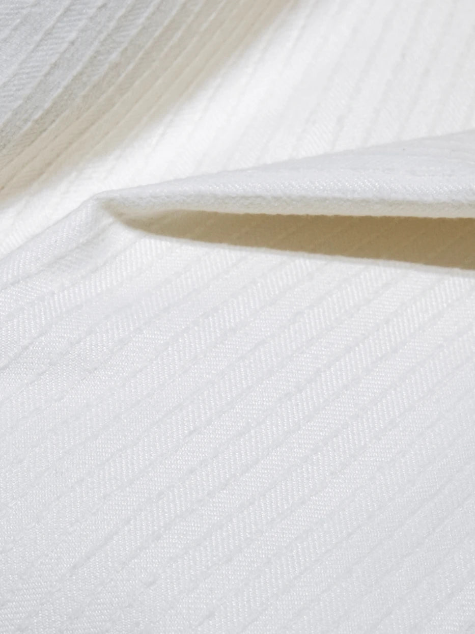 Extreme macro drape texture close-up shot of BERLIN wool blend white stripe cushion cover, showing dense vertical ribbed stripe texture and seamless neat finished edge, fully presents delicate vertical rib knit grain and soft matte fabric luster, professional texture display for high-end minimalist home textile cushion products