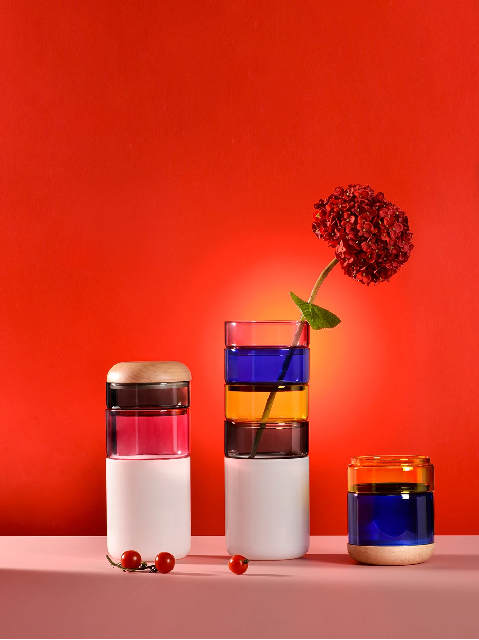 Art display furnishing shot of two sizes Color Block vases matched with red hydrangea on pink countertop against solid red background wall