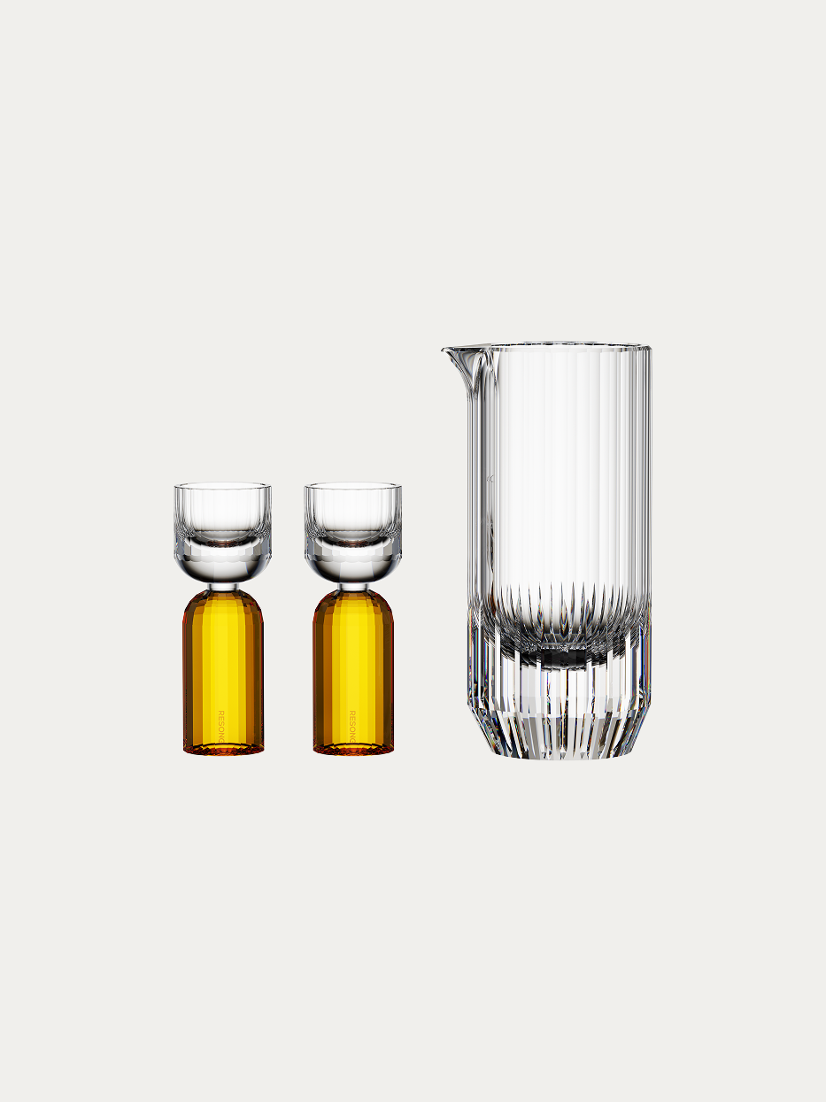 RESONG HOME HAOYING Baijiu Set (Amber), full vertical hand cut crystal liquor serving pitcher + 2 dual-tone amber base shot glasses, plain off-white background official product photo