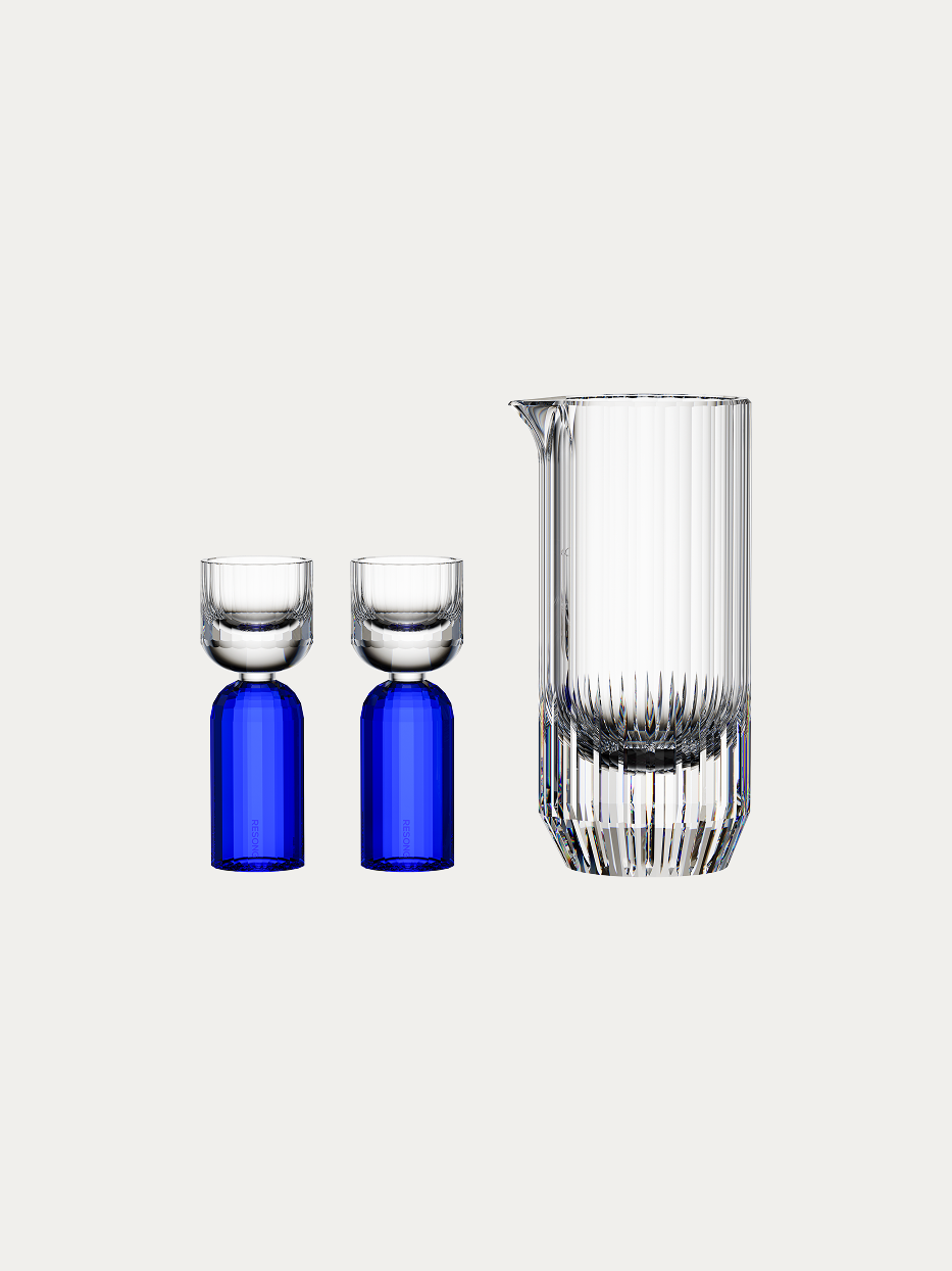 RESONG HOME HAOYING Baijiu Set (Blue), full vertical hand cut crystal liquor serving pitcher + 2 dual-layer shot glasses with sapphire blue base, plain off-white background official product photo