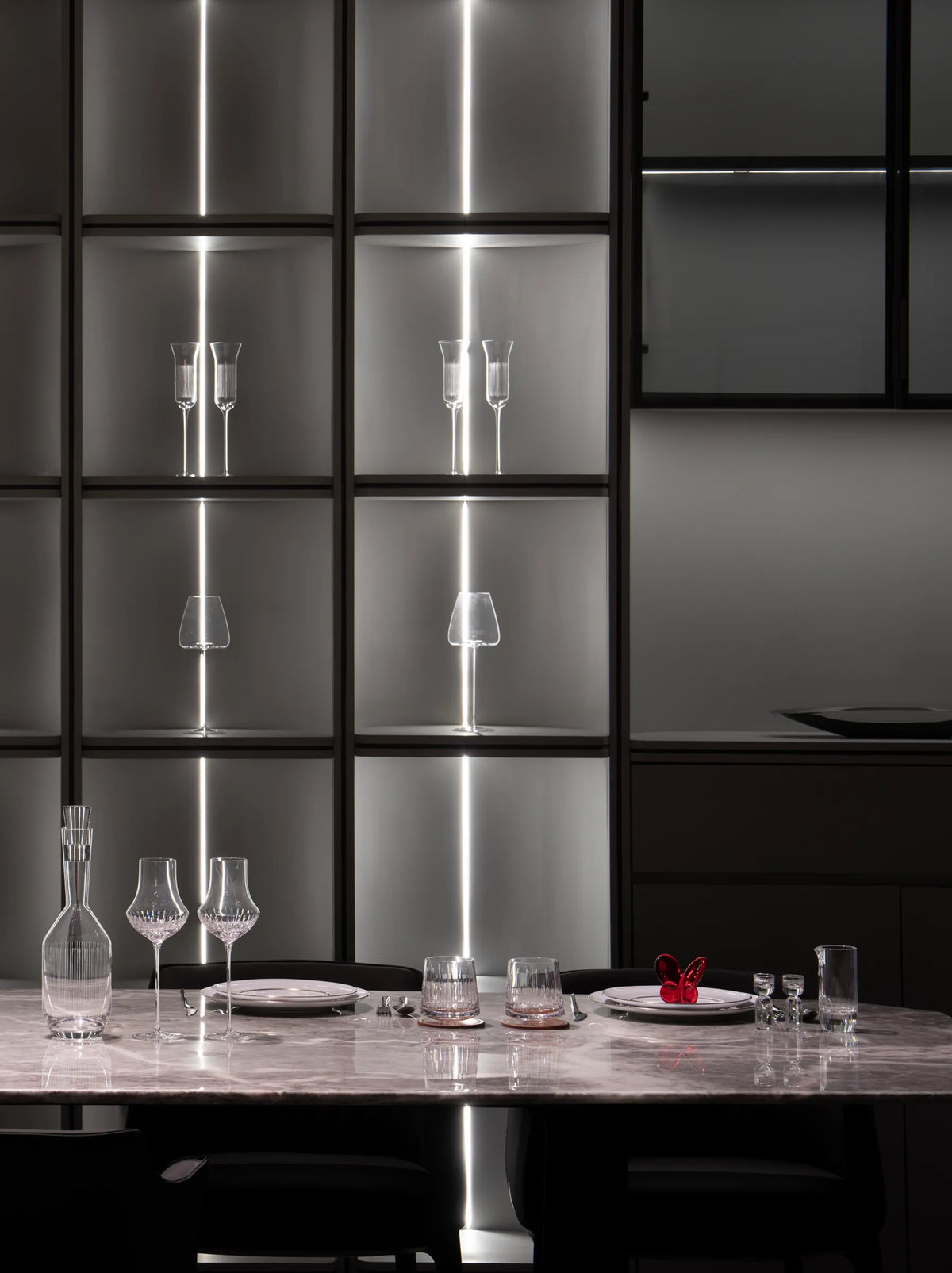 RESONG HOME modern table setting featuring the STARLIGHT Crystal Collection, BUTTERFLY Collection sculpture and elegant dining accessories in a contemporary luxury interior.