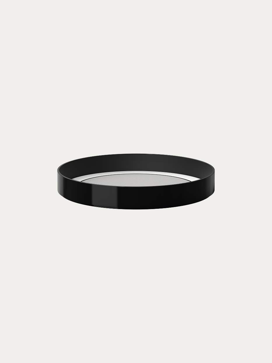 RESONG OPTICAL ART Medium Black Round Tray official shot on plain off-white background, integrated shallow round basin with glossy black outer rim, symmetrical herringbone anti-slip texture on inner base, minimalist luxury storage tray