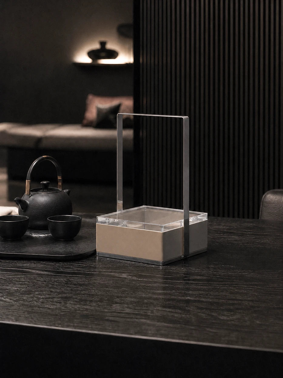 Zen tea room furnishing layout of small PAIS storage basket matched with black ceramic tea set on solid wood table