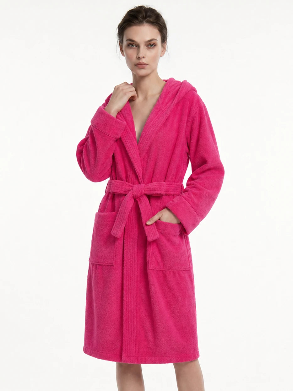 Pure white background half-body side shot of model wearing R Series rose red cotton hooded bathrobe, shows V-neck lapel, waist tie tightening and folded cuff details, presents soft draping wearing effect of cotton terry fabric