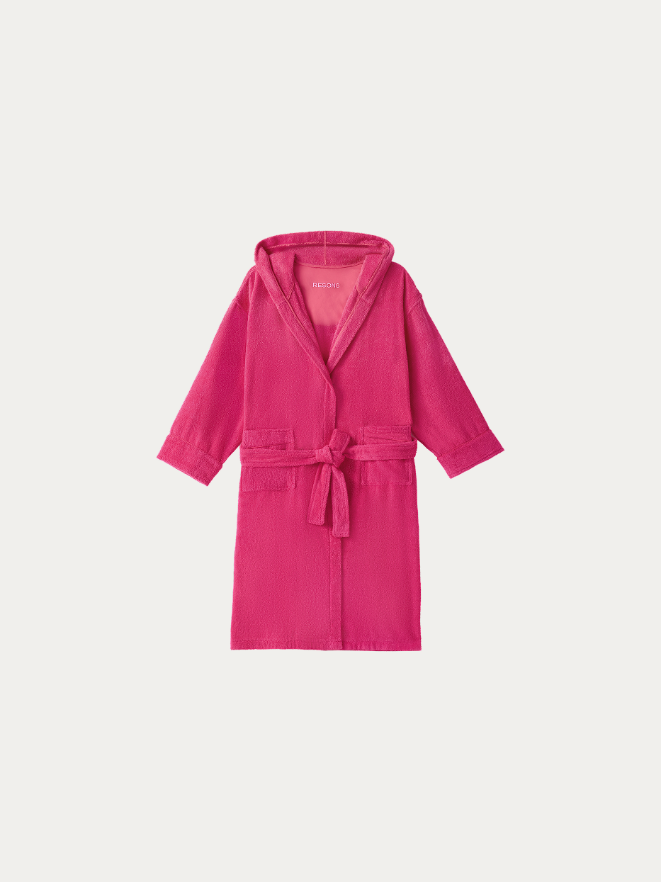 Official hanging product shot of R Series rose red hooded bathrobe on pure off-white background, 100% thick cotton terry fabric, three-dimensional hood, kimono V-collar, matching fabric wide waist tie, dual large side patch pockets, long water-absorbent dual-purpose bathrobe for home & hotel use
