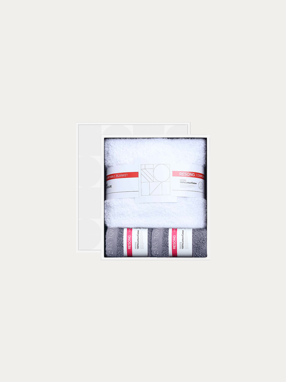 Official window gift box shot of R Series mixed set (2 grey face towels + 1 white bath towel) on pure off-white background, includes 2 grey face towels & 1 full-size white bath towel, 100% cotton heavyweight thick terry, minimalist red-white brand waist band, unisex premium business bathroom gift set