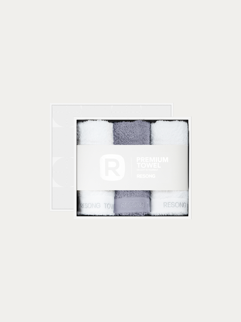 Official window gift box product shot of R Series 1 grey + 2 white face towel set on pure off-white background, contains 1 grey & 2 white cotton face towels, 200g heavyweight 100% cotton terry, minimalist RESONG brand waist band, unisex premium business gift set