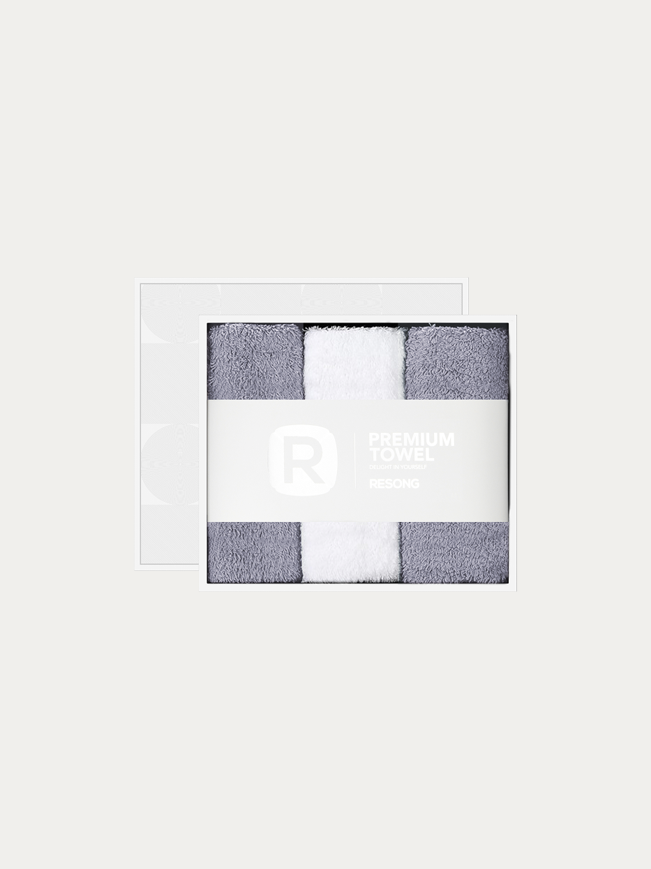 Official window gift box product shot of R Series 2 grey + 1 white face towel set on pure off-white background, contains 2 grey & 1 white cotton face towels, 200g heavyweight 100% cotton terry, minimalist RESONG brand waist band, unisex neutral premium gift set for daily gifting