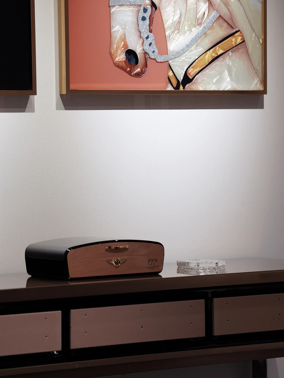 Mid-century entryway layout shot of RUIYING crystal cigar holder matched with leather cigar box on walnut console cabinet