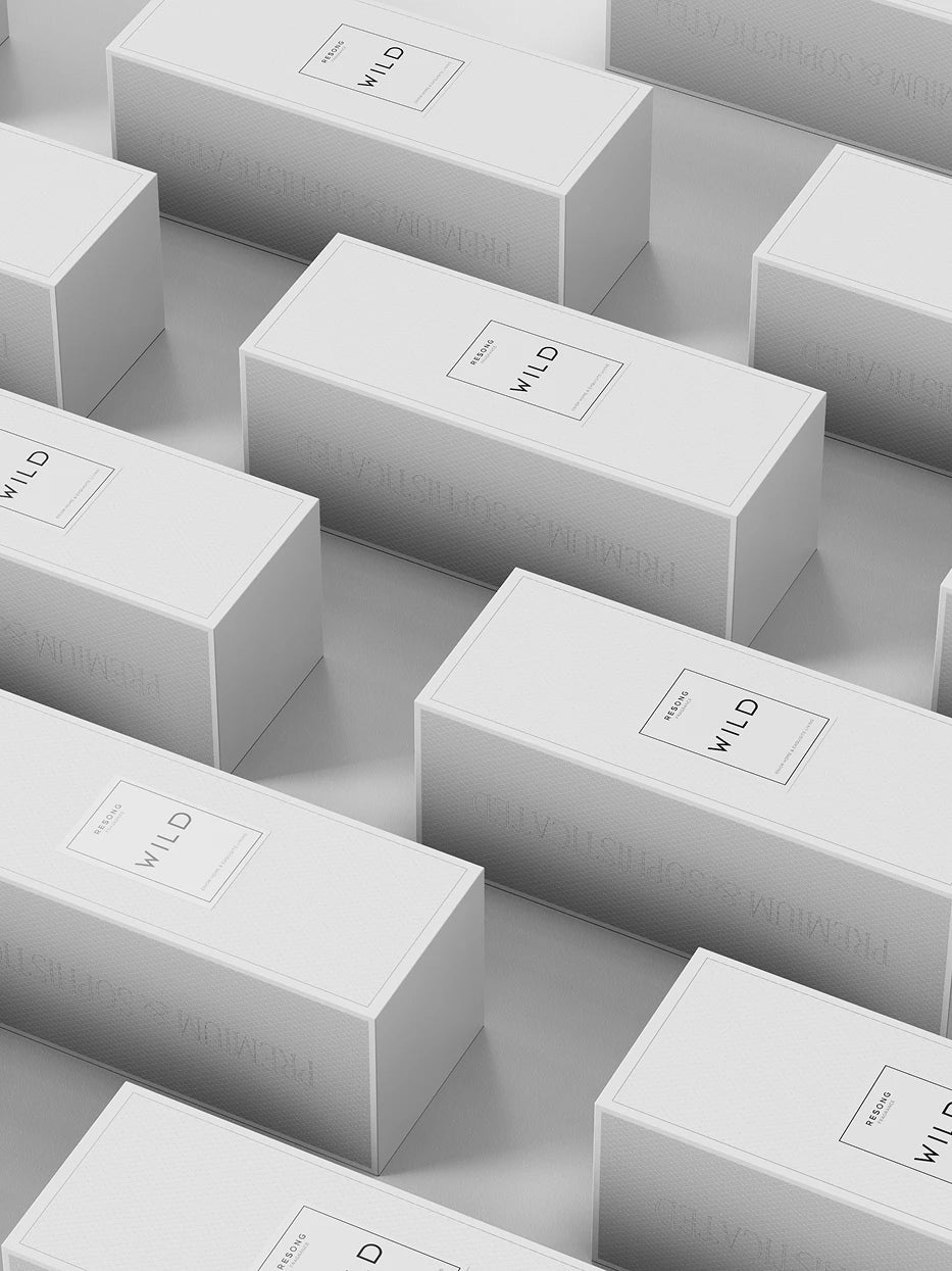 Light minimalist display furnishing shot of multiple WILD textured white gift boxes neatly arranged