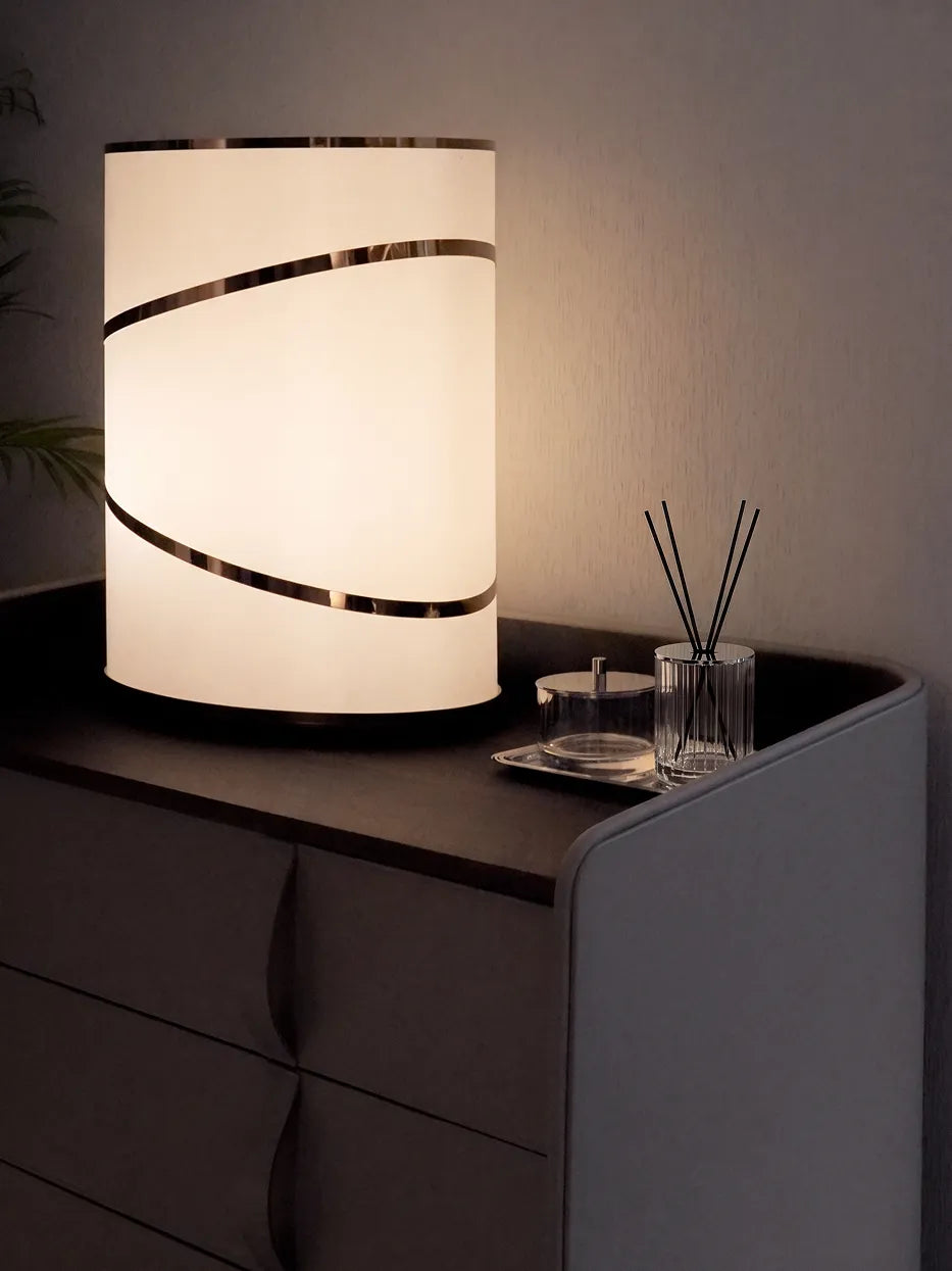 Dark minimalist bedroom furnishing shot of matching XUYU crystal set (storage box + reed diffuser) on dark leather nightstand