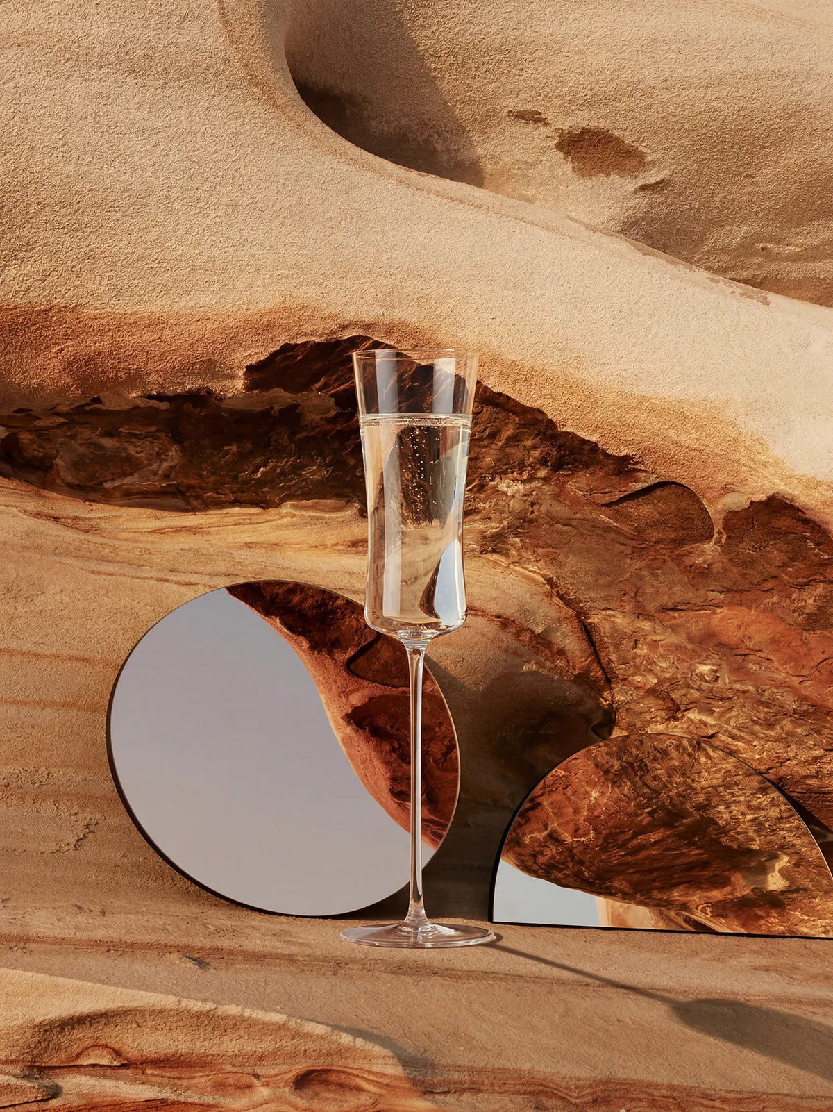 Official lifestyle image of the RESONG 1833 Champagne Flute (Pair), featuring elegant crystal champagne glasses styled for fine dining, celebrations, and contemporary entertaining.