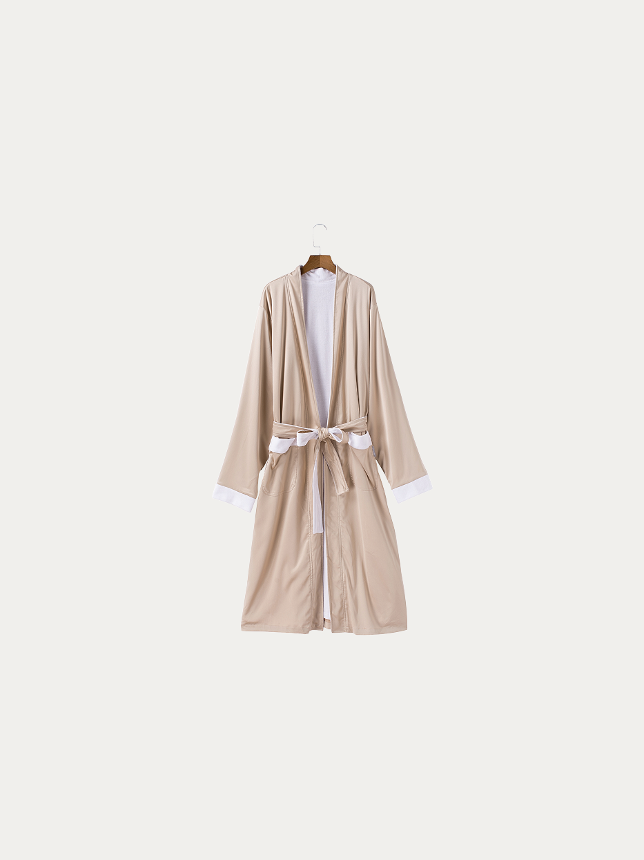 Official hanging product shot of HERA double-layer amber bathrobe size M on pure off-white background, smooth amber polyester outer fabric, inner 100% cotton white terry lining, kimono V-collar, matching fabric waist tie, double side patch pockets, long dual-purpose bathrobe for home & hotel use