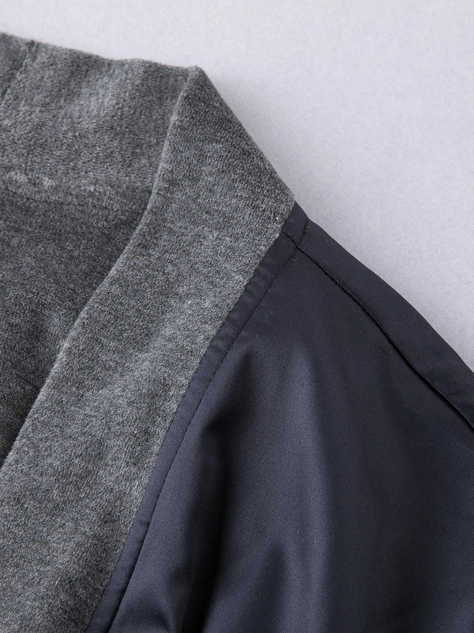 Macro close-up of kimono V-lapel contrast trim of HERA double-layer bathrobe, full grey cotton lining wrapping edge, neat uniform lock stitching, displays precise well-fitted craft of double-layer fabric