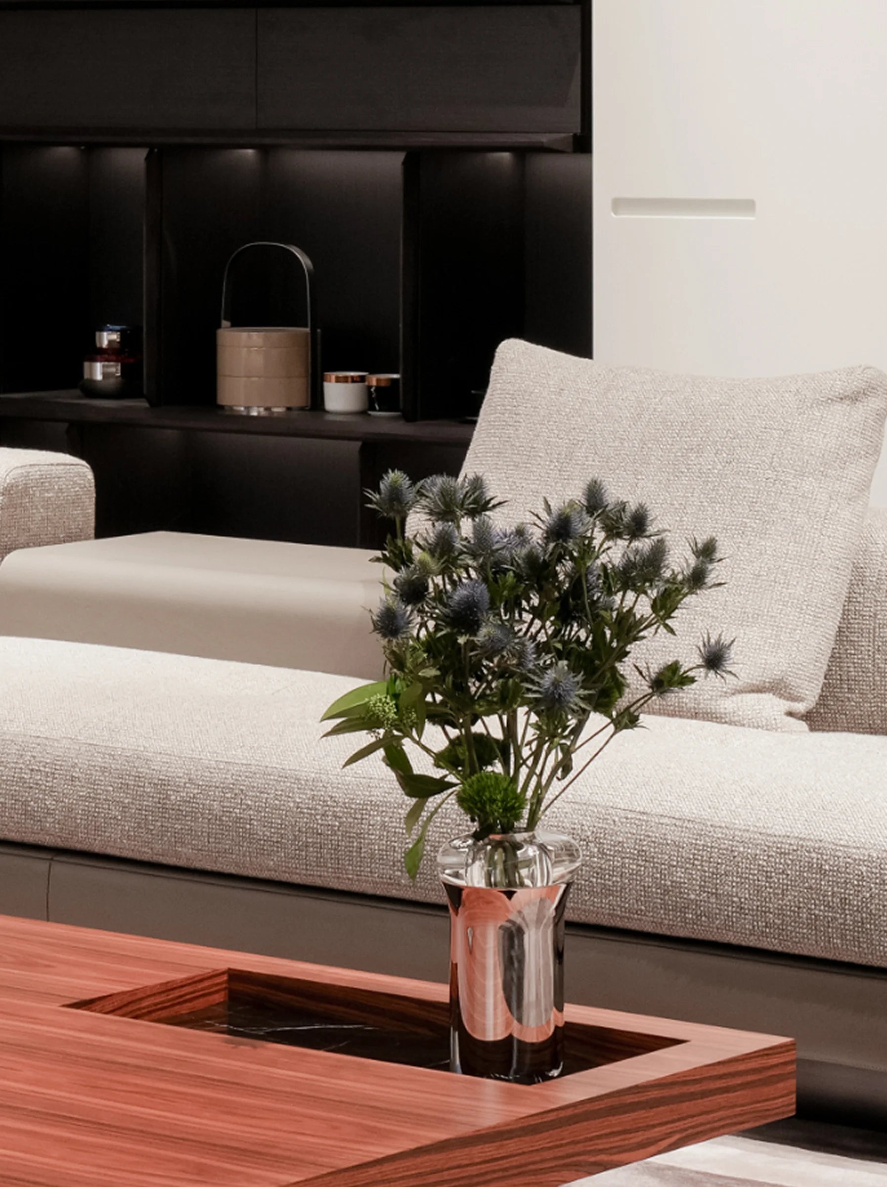 RESONG HOME SHEDI Double-Wall Vase displayed with a contemporary floral arrangement in a modern living room, highlighting polished stainless steel craftsmanship and elegant home styling.