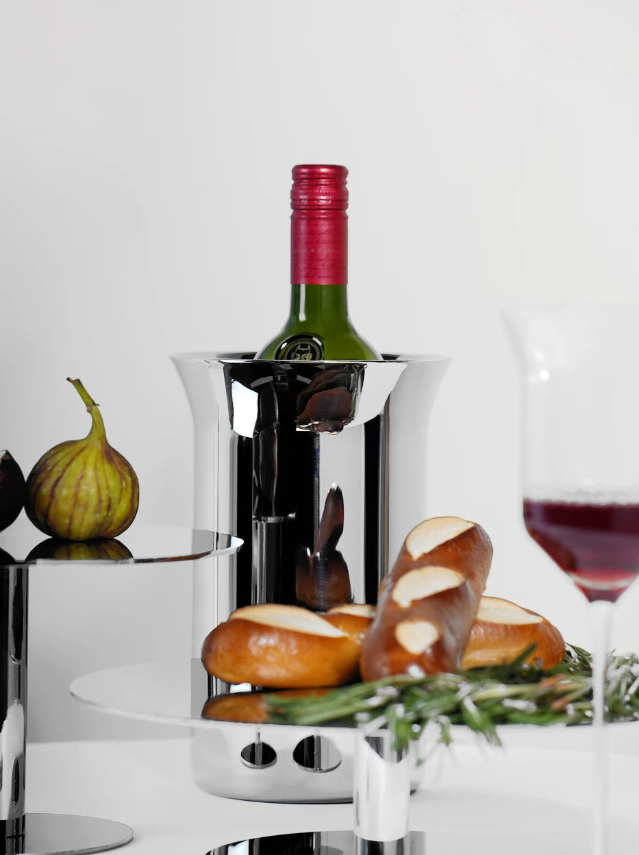 Light luxury dining table lifestyle shot of SHEDI double-wall wine bucket holding red wine bottle, matched with two-tier metal dessert stand, figs and baked bread for afternoon wine display
