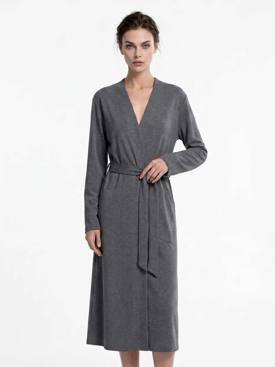 Pure white background full-body front shot of model wearing size L MAYA dark gray stretch bathrobe, fully displays kimono open lapel, side pocket and long draping silhouette, shows daily home rest overall wearing effect
