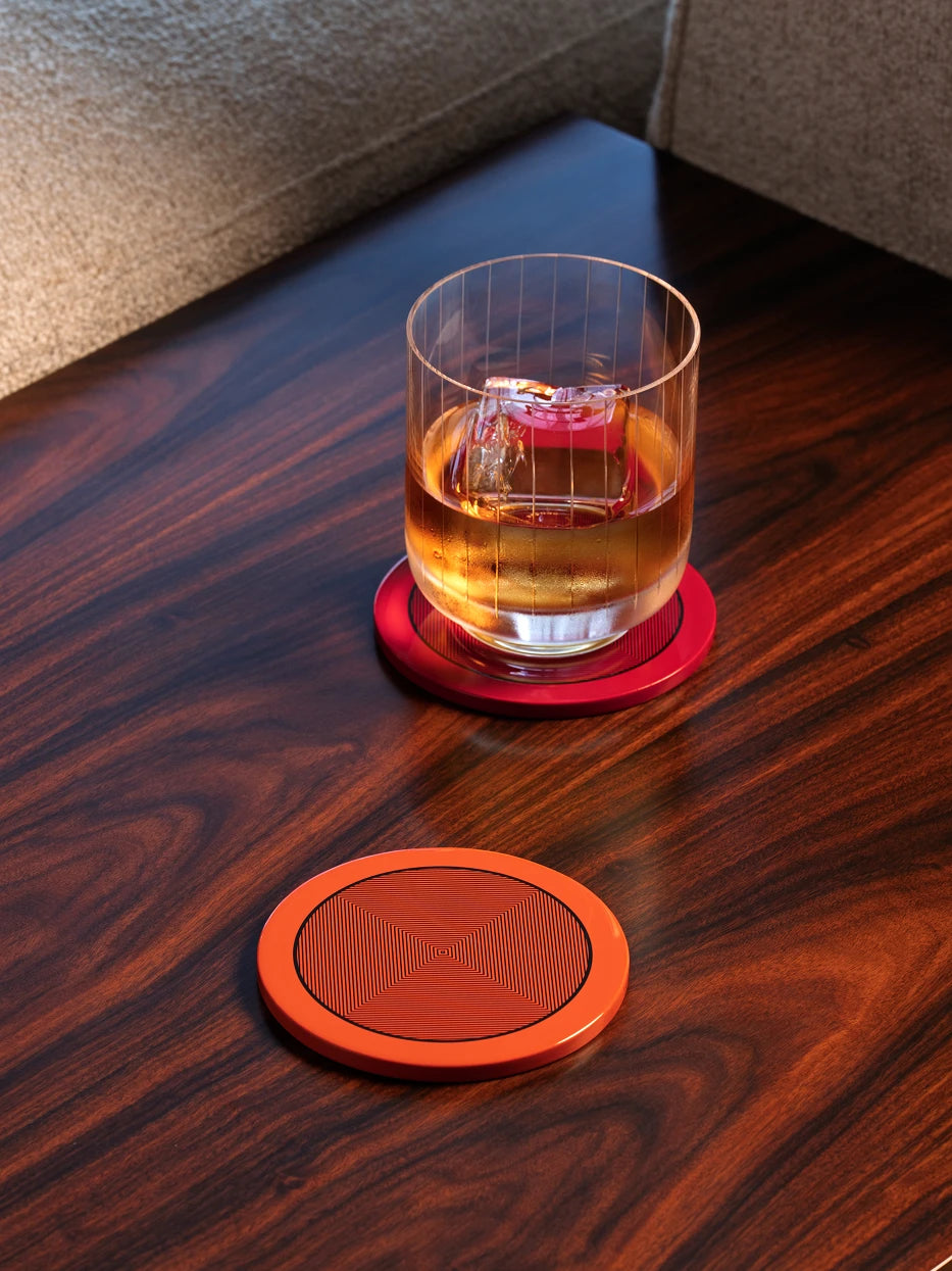 RESONG OPTICAL ART Round Coaster Orange featuring a vibrant lacquer finish and Op Art inspired geometric pattern, a handcrafted decorative coaster for luxury home bar, whisky glass presentation, coffee table styling and contemporary interiors.