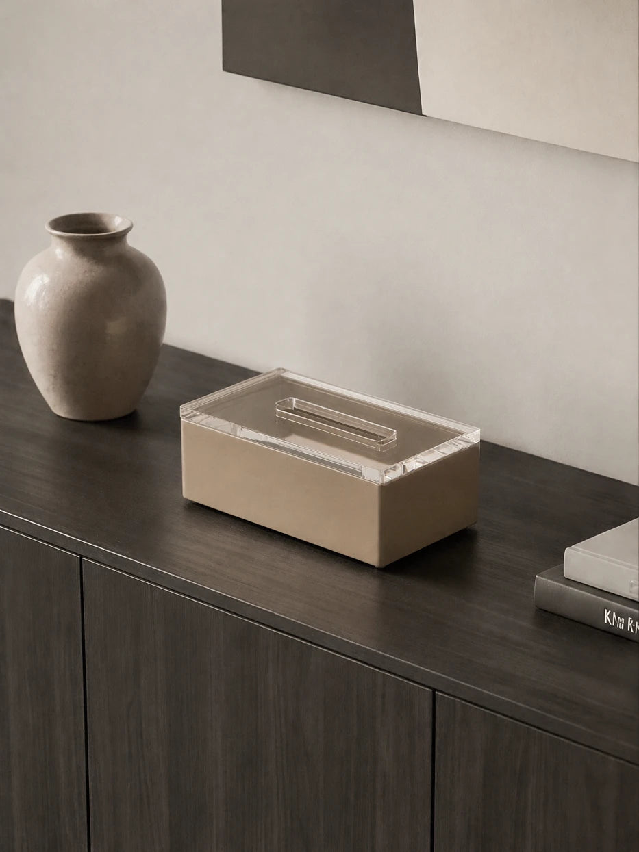 Quiet minimalist bedroom furnishing shot of PAIS khaki tissue box on dark grey solid wood vanity cabinet against plain wall