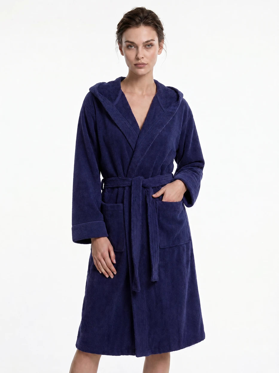 Pure white background full-body front shot of model wearing R Series navy blue cotton hooded bathrobe, showing loose dropped shoulder long well-fitted silhouette, fluffy thick cotton terry soft skin-friendly texture, highlighting strong water-absorbent comfortable wearing experience of 100% cotton