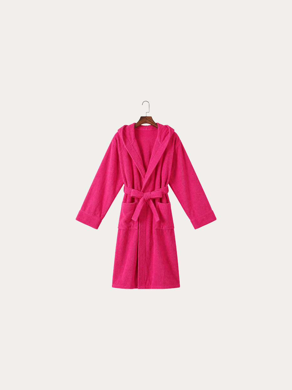 Official hanging product shot of R Series rose red hooded bathrobe on pure off-white background, 100% thick cotton terry fabric, three-dimensional hood, kimono V-collar, matching fabric wide waist tie, dual large side patch pockets, long water-absorbent dual-purpose bathrobe for home & hotel use