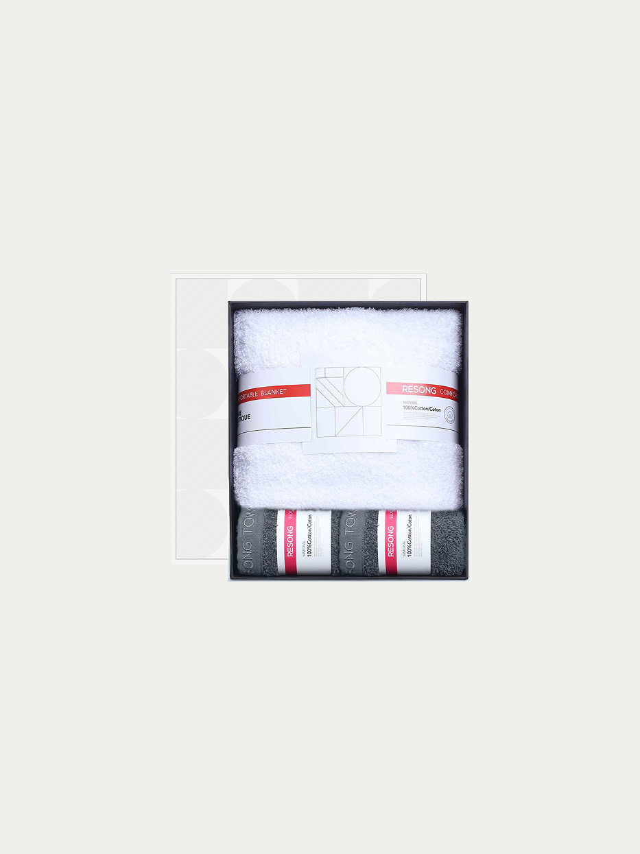Official window gift box shot of R Series mixed set (2 grey face towels + 1 white bath towel) on pure off-white background, includes 2 grey face towels & 1 full-size white bath towel, 100% cotton heavyweight thick terry, minimalist red-white brand waist band, unisex premium business bathroom gift set