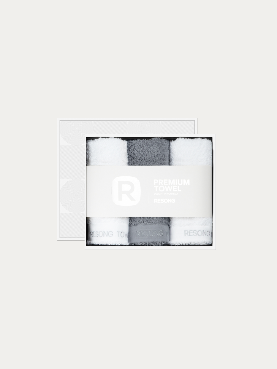 Official window gift box product shot of R Series 1 grey + 2 white face towel set on pure off-white background, contains 1 grey & 2 white cotton face towels, 200g heavyweight 100% cotton terry, minimalist RESONG brand waist band, unisex premium business gift set