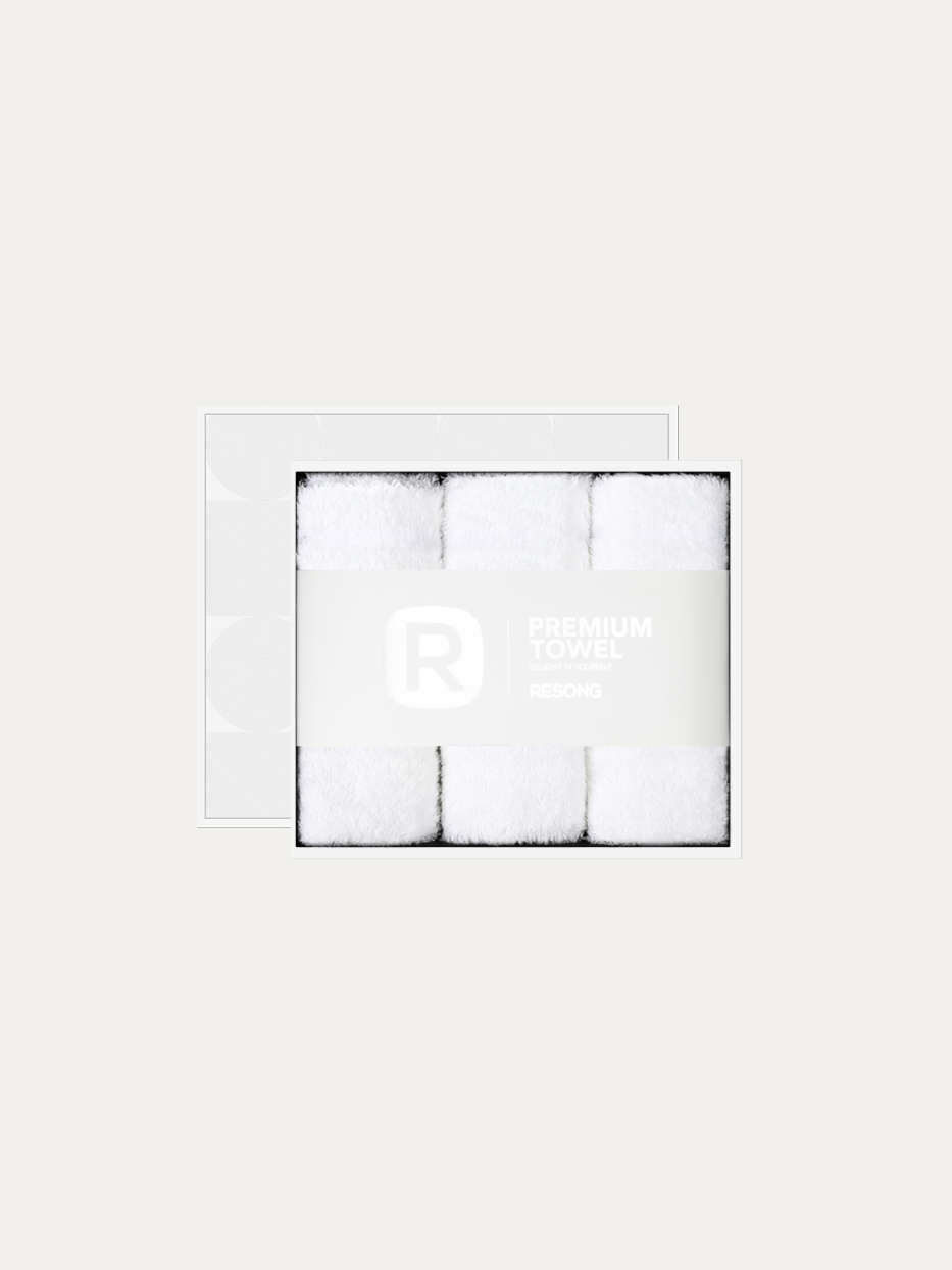 Official window gift box product shot of R Series all-white 3pcs face towel set on pure off-white background, contains 3 white cotton face towels, 200g heavyweight 100% cotton terry, minimalist RESONG brand waist band, premium universal gift set for five-star hotel, wedding & daily gifting