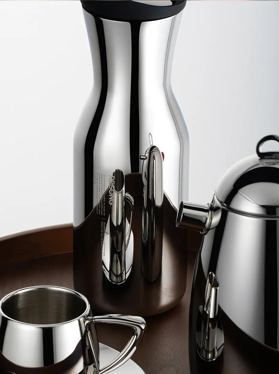 Official close-up image of the RESONG SHEDI Water Carafe, highlighting its mirror-polished stainless steel finish and sculptural contemporary design.