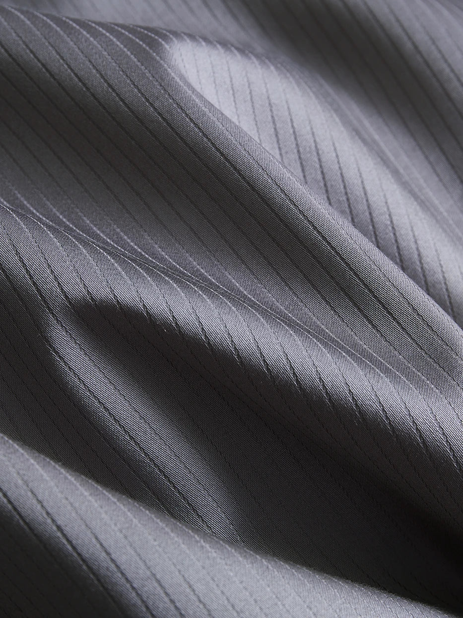 Soft light close-up shot of YALIAN cotton fabric, showing even delicate vertical mini jacquard stripes, tight high-density weaving