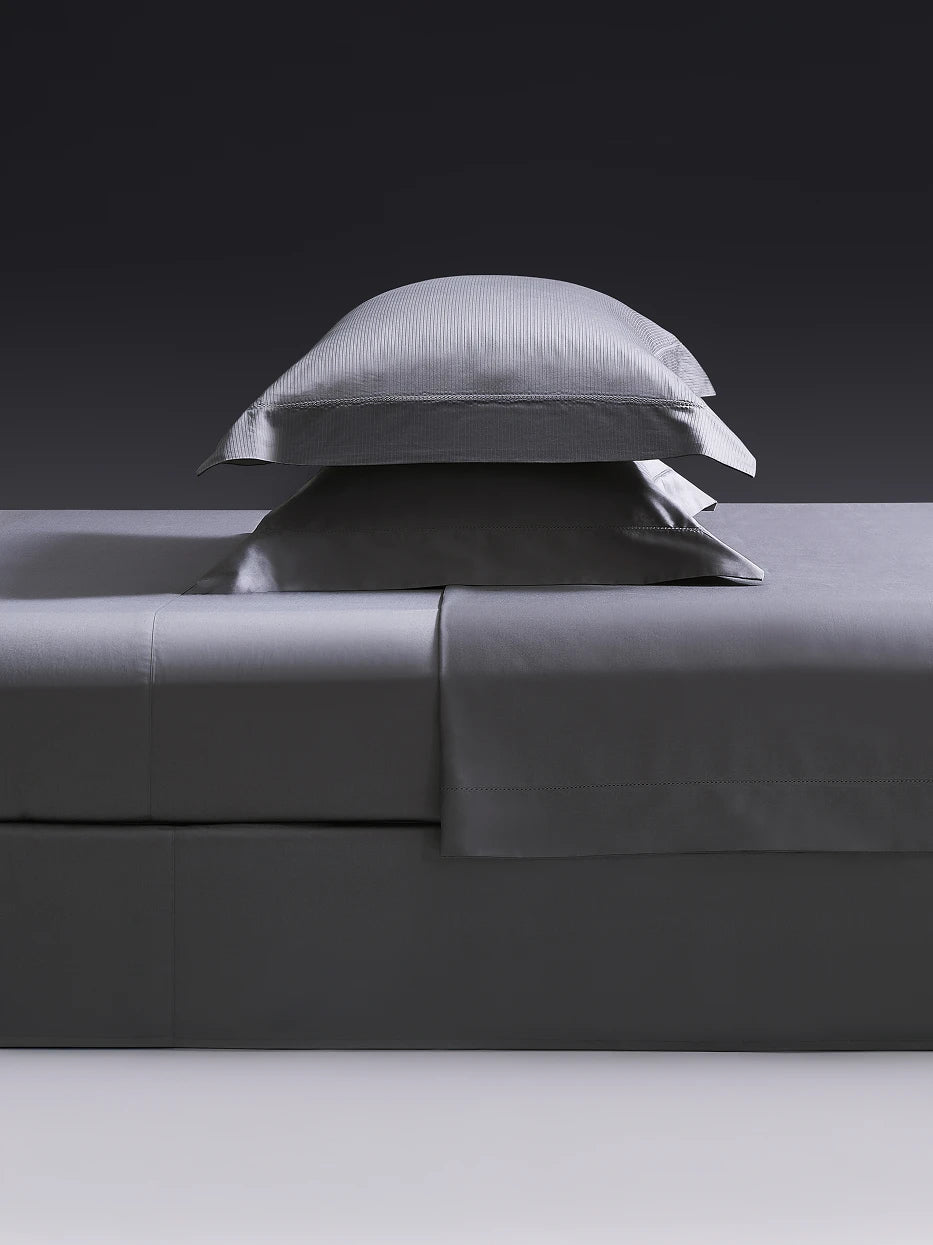Close-up furnishing shot of full YALIAN bedding set showing vertical mini jacquard fabric & delicate cutwork edge