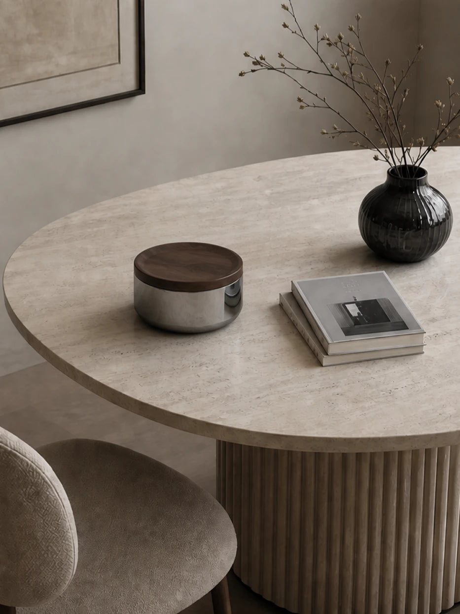 Minimal wabi-sabi still life shot of YINGMU L storage can with hardcover books and retro flower vase on round travertine table